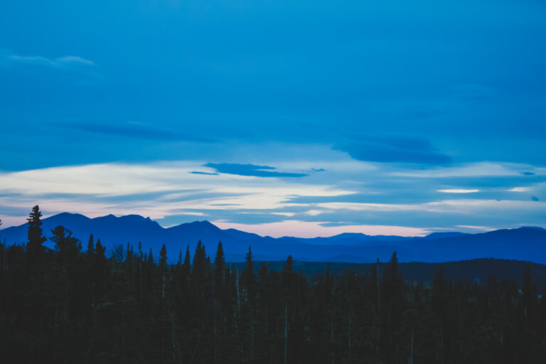 Rocky Mountains covered in blue at dusk leaving Brainard Lake, Colorado, US - Photography by Som Prasad